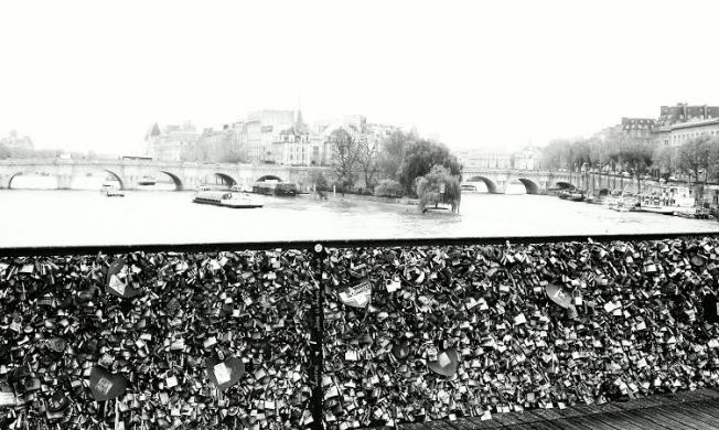 A view of Pont Neuf from the Love Lock encrusted Des Arts Bridge.